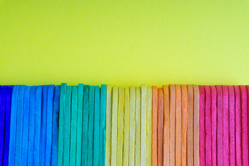 Colorful wooden or ice cream stick with selective focus and crop fragment