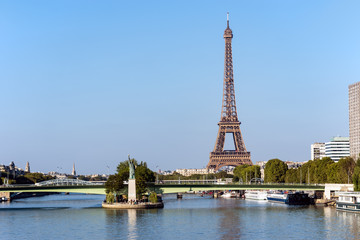 Replica of the Statue of Liberty on the Ile aux Cygnes with Eiffel tower in background - Paris, France