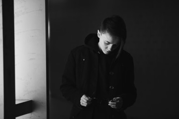 strong, laid back, cool girl, tomboy in black and white street style scene. Outdoor fashion images...