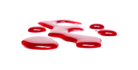Spilled red wine puddle isolated on white background 