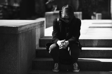 strong, laid back, cool girl, tomboy in black and white street style scene. Outdoor fashion images...