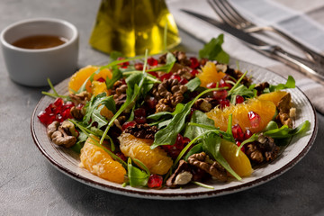 Arugula salad with oranges, walnuts and pomegranate.