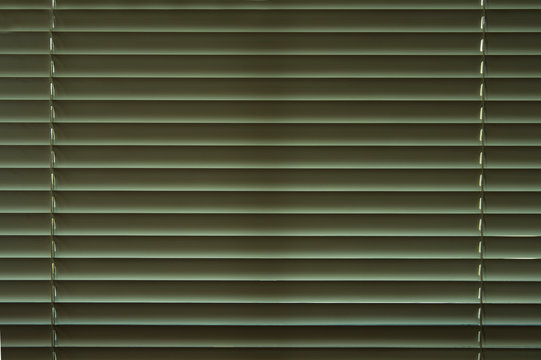 Closed venetiann blindes in the dark room