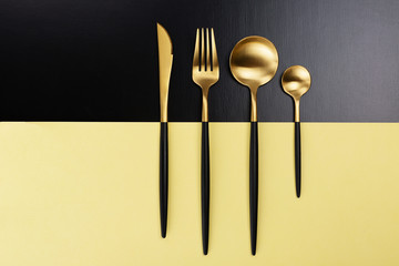 Set of black and gold cutlery