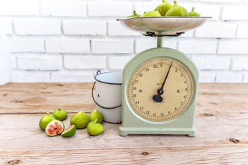 Antique kitchen scale and ripe figs