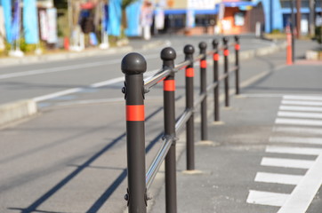 Iron fence to distinguish road and sidewalk