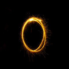 Numbers 0 to 9 created using a sparkler on black