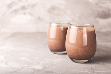 Two glasses of cocoa drink - obrazy, fototapety, plakaty