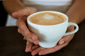 perfect morning with best coffee. relax in cafe or coffee shop and drink. fresh morning coffee with milk and cream froth. barista propose americano or espresso coffee cup. Good start of the morning