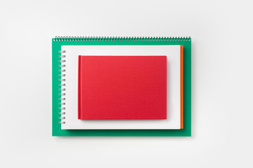 Top view of green and red spiral notebook