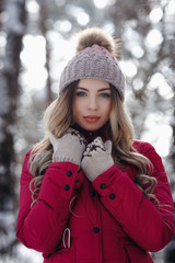 young beautiful smiling white tooth girl with amazing hair portrait wearing purple down jacket in winter snowy forest. Winter holiday concept - Image