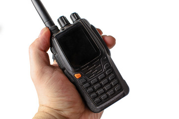male hand holding a walkie talkie on a white background. Isolate - obrazy, fototapety, plakaty