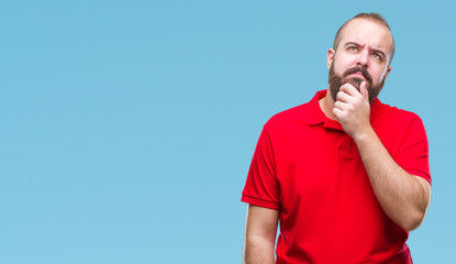 Young caucasian hipster man wearing red shirt over isolated background looking confident at the...