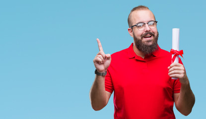 Young hipster man wearing glasses and holding degree over isolated background surprised with an idea or question pointing finger with happy face, number one