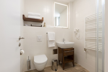 Fototapeta na wymiar Modern hotel white bathroom interior