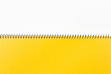 Top view of yellow spiral notebook, page