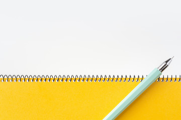 Top view of yellow spiral notebook, page