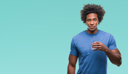 Afro american man drinking glass of water over isolated background with a confident expression on smart face thinking serious