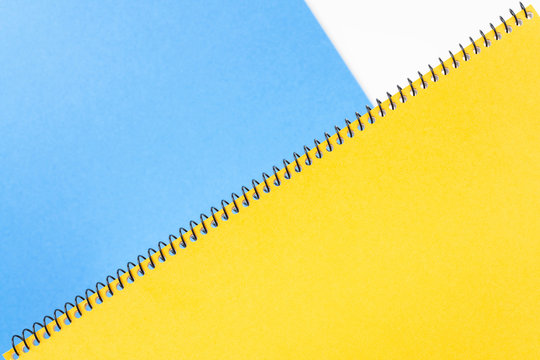 Top View Of Yellow Spiral Notebook, Blue Page