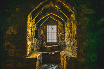 View through ancient medieval window of a Scottish castle melancholia concept historical travel concept  melancholy 
