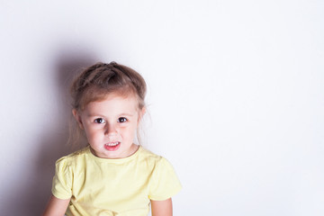 Angry little girl over white background