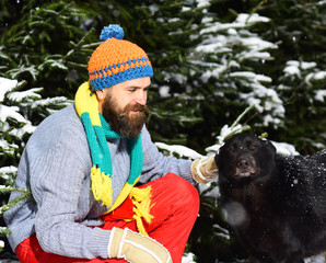 Friendship and allegiance concept. Man wears knitted hat, scarf, gloves