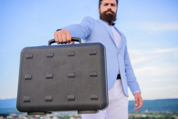 Business man formal suit carries briefcase sky background. Businessman presenting business case....