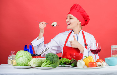 Healthy ration. Woman professional chef hold spoon with raw mushroom. Dieting concept. Girl wear hat and apron try mushroom taste. Healthy vegetarian and vegan recipes. Healthy raw food. Eat healthy