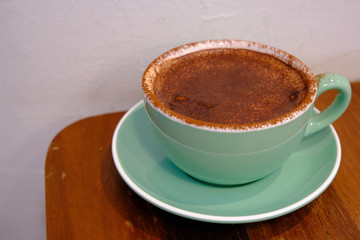 Hot Mocha - A Cup of Coffee on wooden table background and copy space, Morning Breakfast.