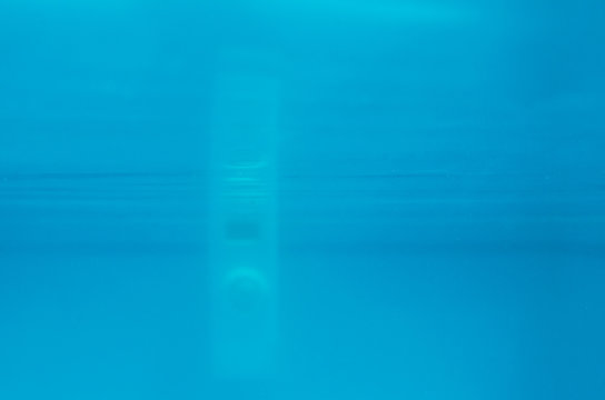 Photograph of an engine of a swimming pool under water
