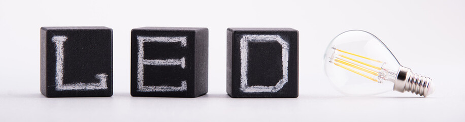 The inscription "LED"on the black cubes next to the LED lamps