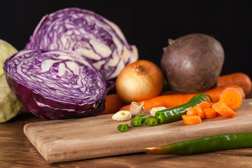 Verious fresh vegetables on a wooden table, healthy food