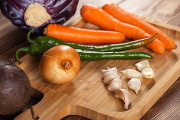 Verious fresh vegetables on a wooden table, healthy food