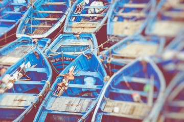 Fishing blue boats in Marocco. Lots of blue fishing boats in the port of Essaouira, Morocco. Selective Focus.