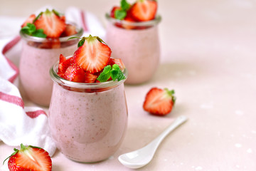 Homemade strawberry mousse in a vintage glass jar.