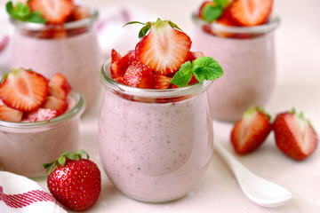 Homemade strawberry mousse in a vintage glass jar.