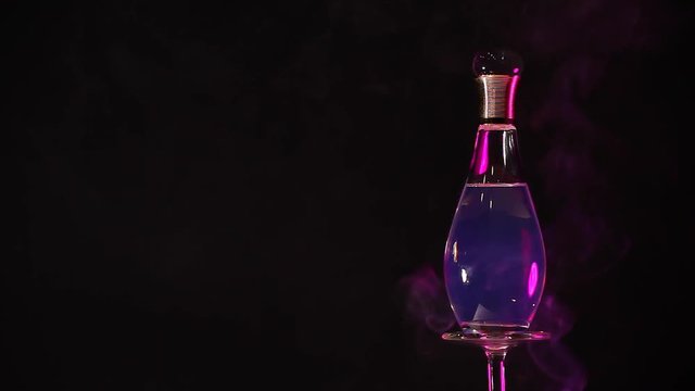 glass perfume bottle purple smoke hd footage 