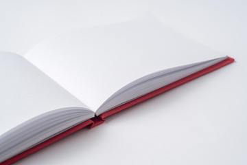 Perspective red notebook with open page