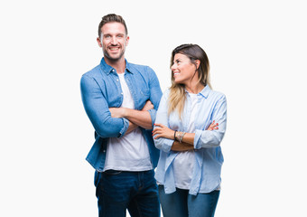 Young couple in love over isolated background happy face smiling with crossed arms looking at the camera. Positive person.