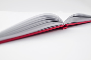 Perspective red notebook with open page