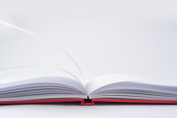 Perspective red notebook with open page