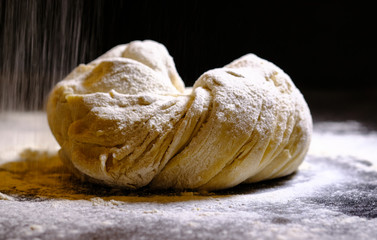 Raw dough on the kitchen table