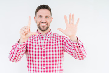 Naklejka premium Young handsome man wearing shirt over isolated background showing and pointing up with fingers number seven while smiling confident and happy.
