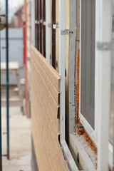 Installing siding on the walls of the house