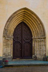 Church of St. Olaf. Old door with decor in the old town. Tallinn. Estonia.
