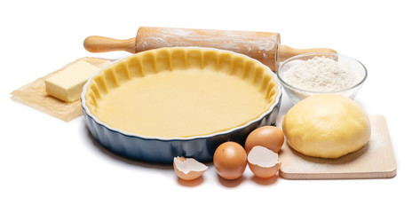 shortbread dough for baking quiche tart and ingredients in baking form