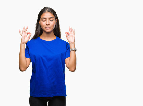 Young beautiful arab woman over isolated background relax and smiling with eyes closed doing meditation gesture with fingers. Yoga concept.