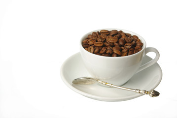 A cup filled with coffee beans. Isolated on white.