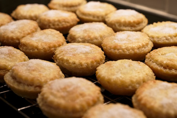 Mince pies fresh homemade by hand close up from above at Christmas on tray