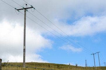 Electricity pylons in the countryside under a cloudy sky in the English Countyrside